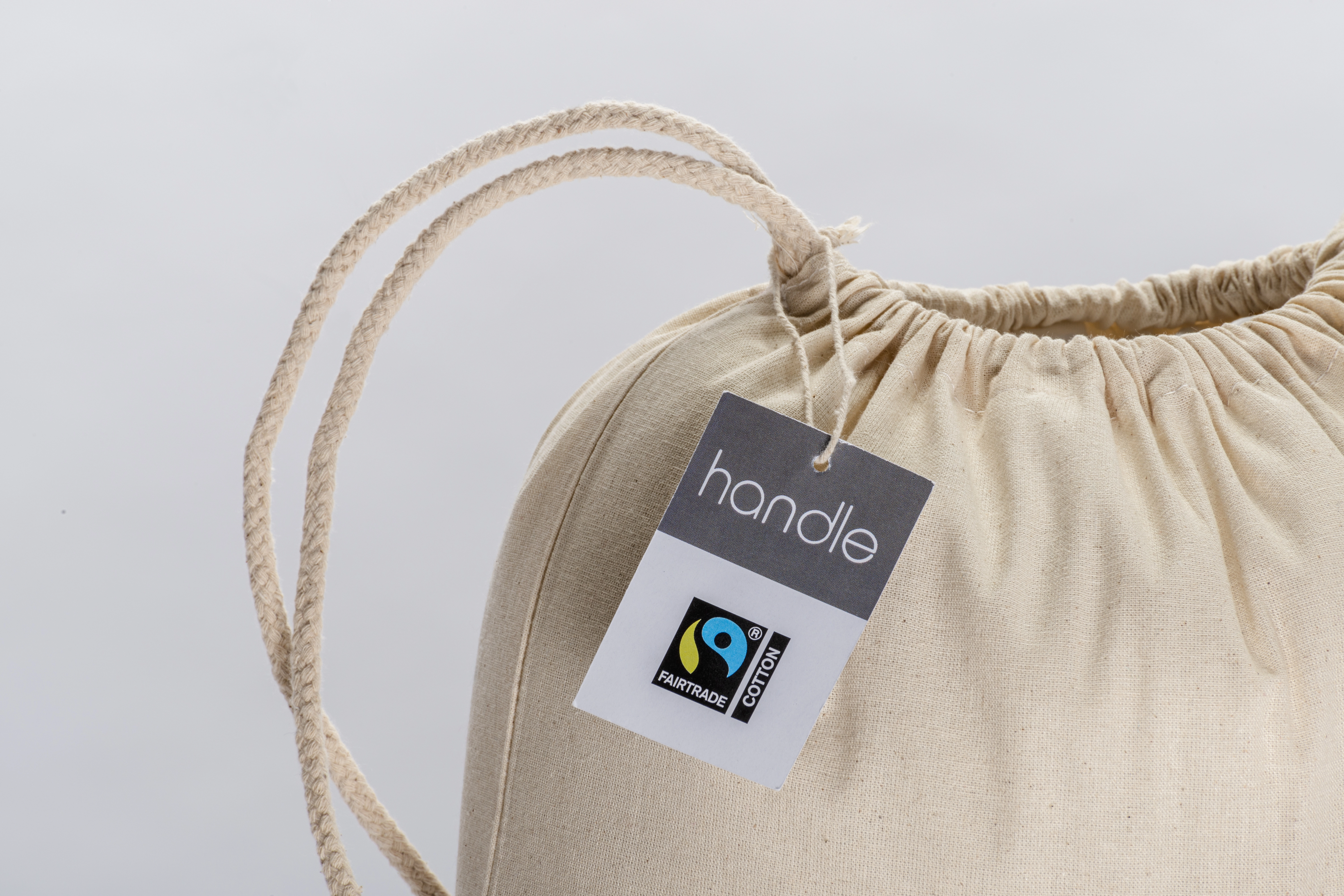 Immagine Zainetto in cotone FAIRTRADE ® 140 g/m2 con chiusura a strozzo